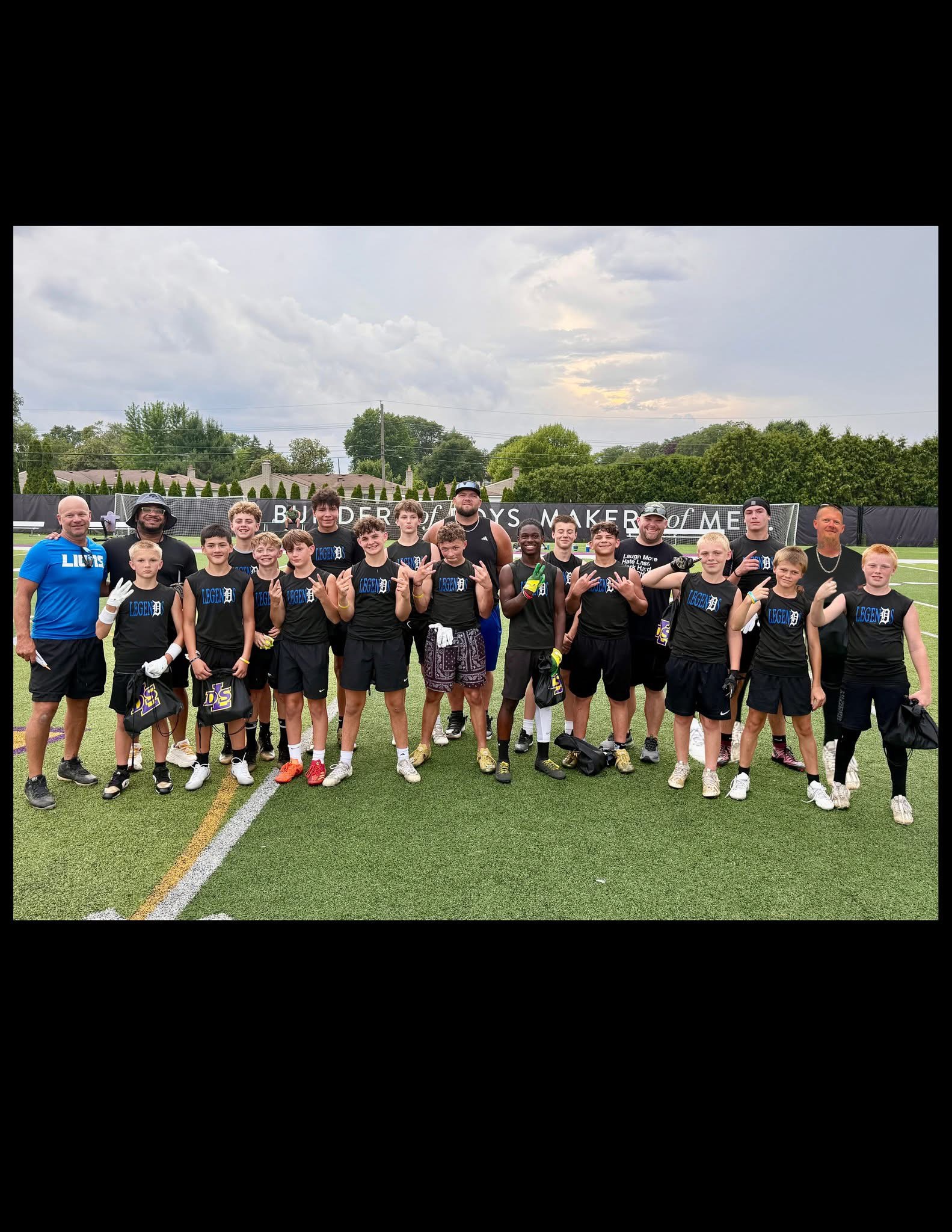 Detroit Legends players and coaches together on the football field
