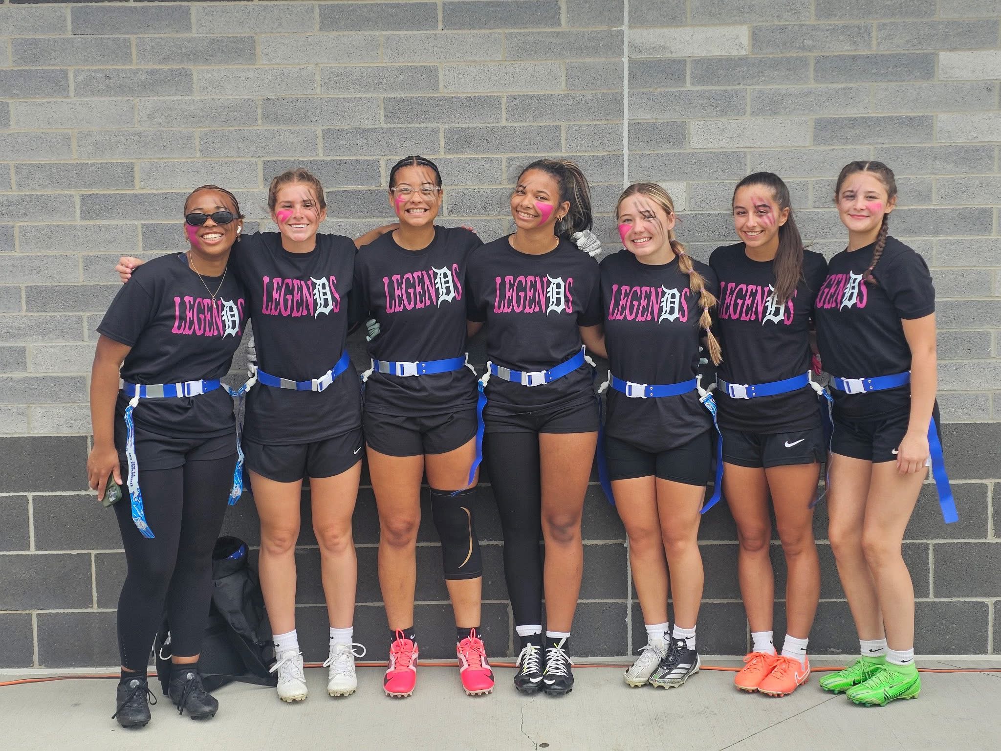 Detroit Legends girls flag football team together in their team shirts